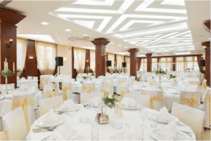 Wedding reception table and chairs in hotel banquet hall with catering